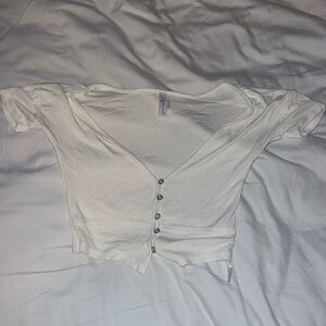 Out from under Urban white button top.